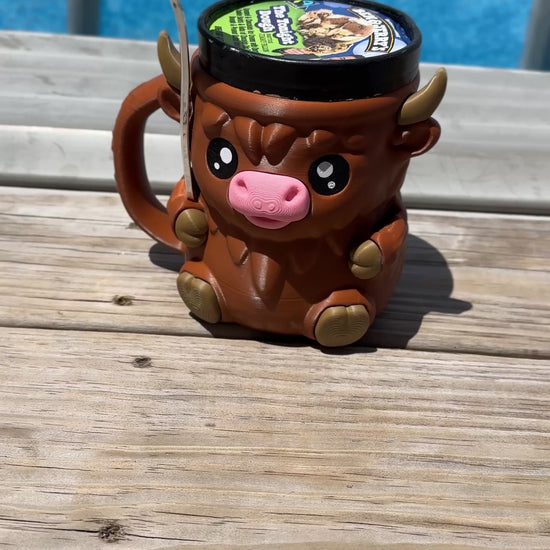 3D-printed Highland Cow pint sleeve.